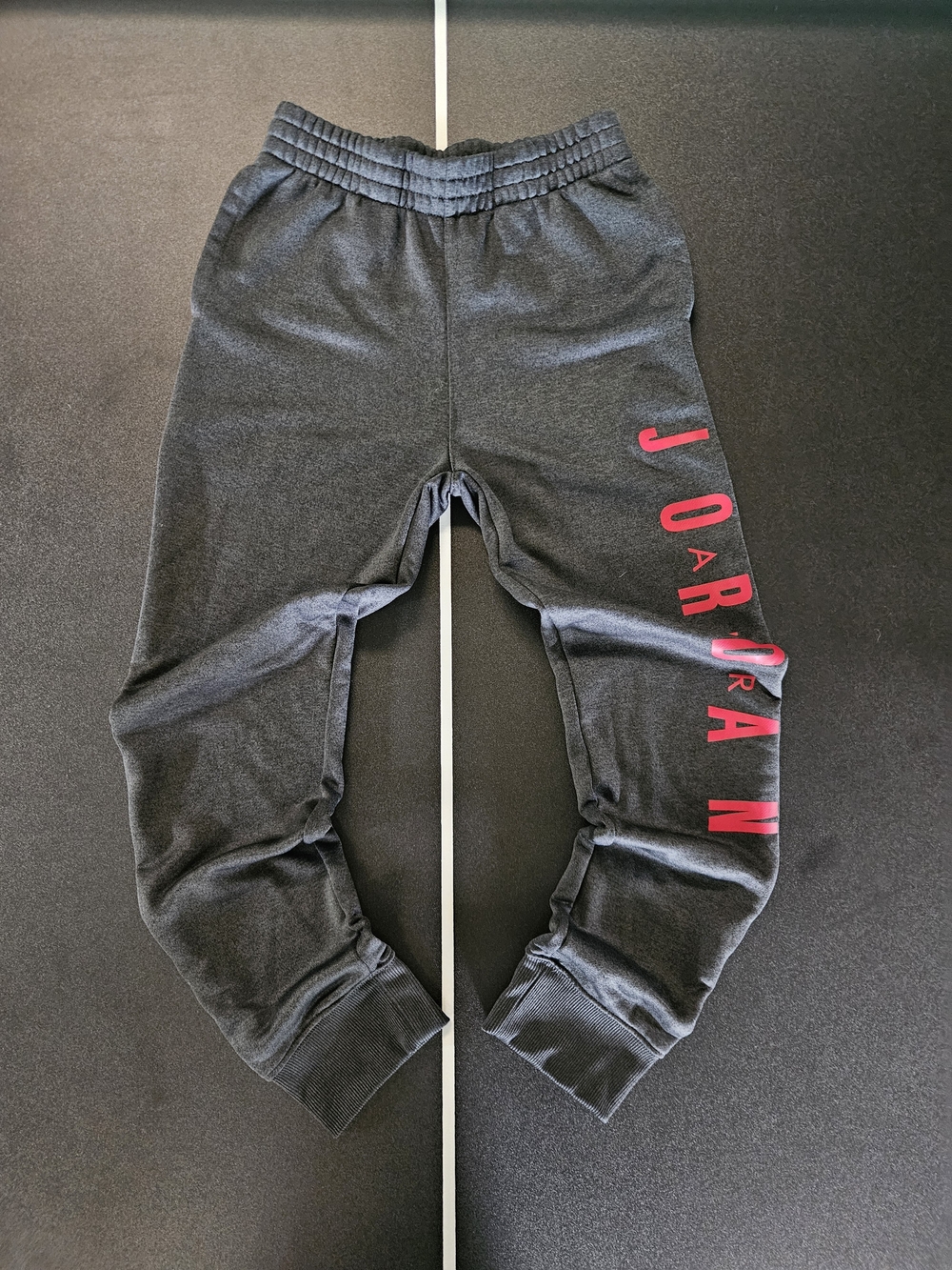 Jordan Kids Black Sweatpants with Red Vertical 'Jordan' Logo